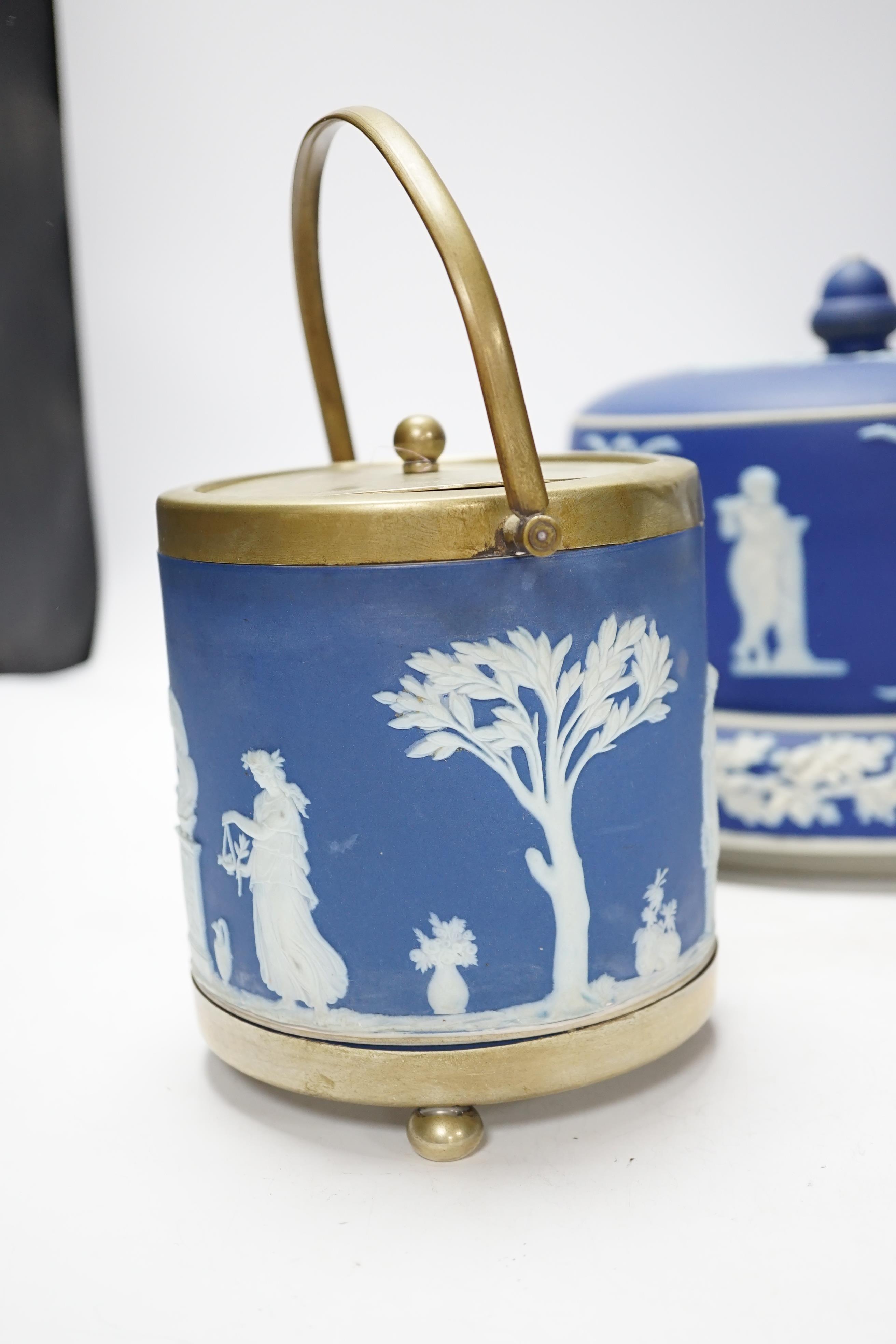 A Victorian Jasper ware cheese dome, a Wedgwood biscuit barrel and a transfer printed blue and white mug, largest 23cm in diameter